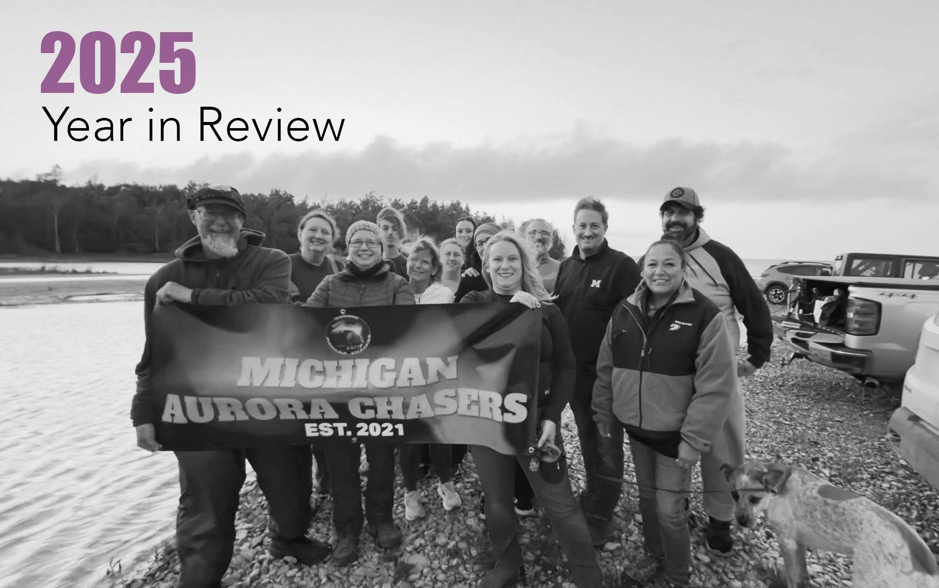 Group photo taken with banner from a guided chase on Beaver Island